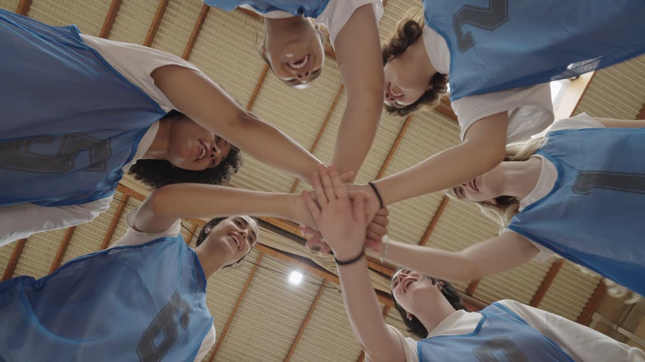 Team of young athletes in a huddle