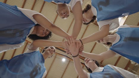 team of young athletes in a huddle