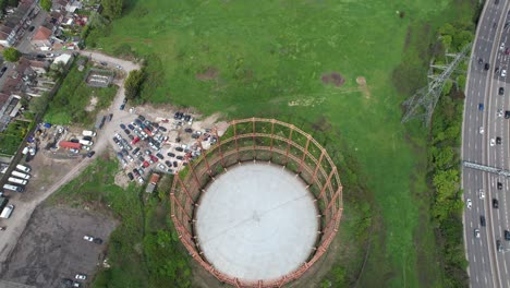 disused gas holder east ham london uk overhead rising drone aerial