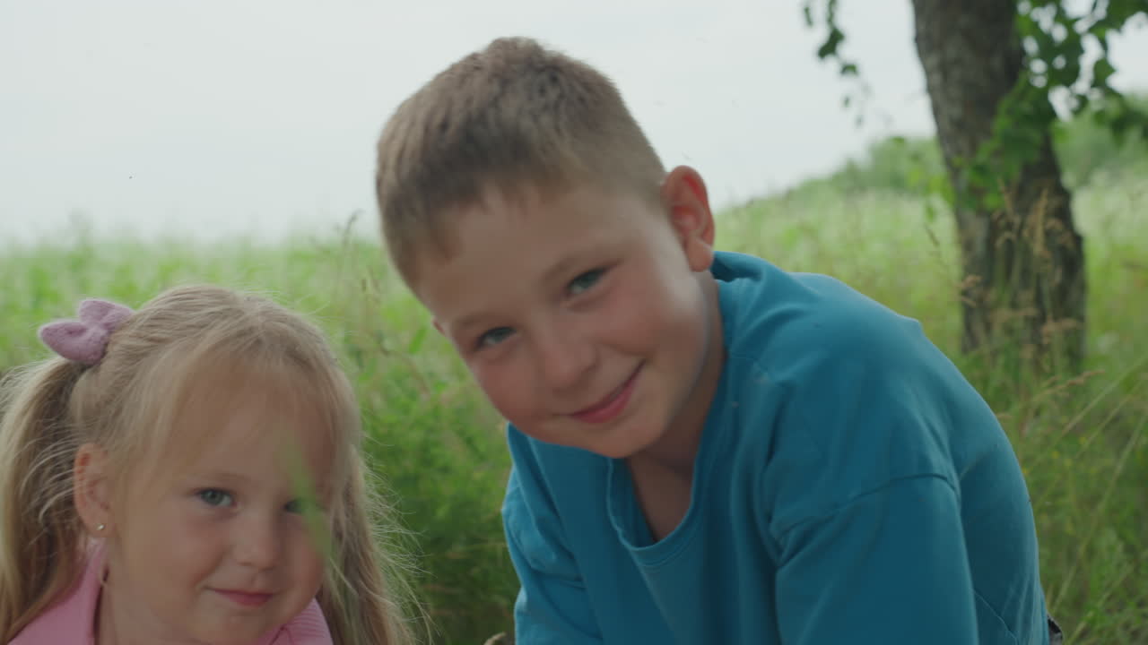 Boy feels joyful, Youth exudes confidence outdoors, Young male displays selfassurance amidst natural environment, Juvenile boy demonstrates certainty while basking in mild sunshine outdoors