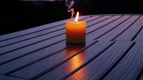 candlelight on a patio table at sunset
