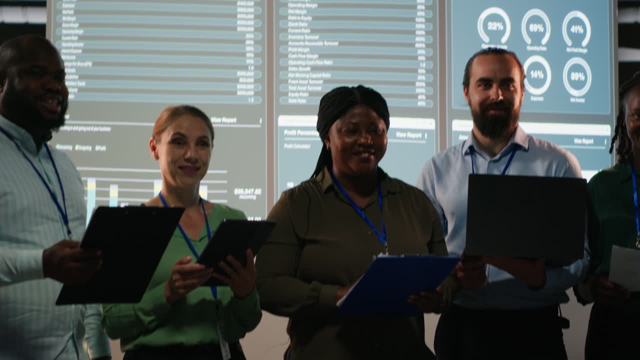 Portrait of team members discuss insight details and progress on a new project