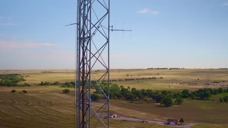Drone-view-of-a-cellular-tower-with-plains-in-the-background