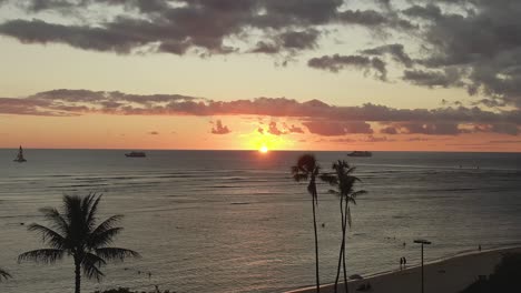 aerial view of the sun setting at ala moana beach in oahu hawaii