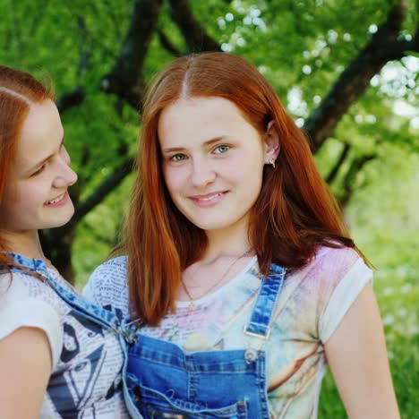 close-up portrait of two happy sisters twins 2