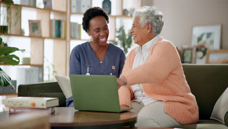 caregiver assisting elderly woman with laptop