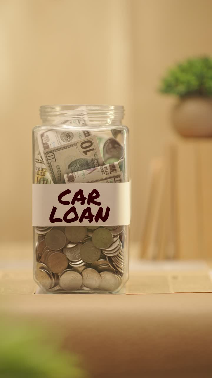 VERTICAL VIDEO OF PERSON SAVING MONEY FOR CAR LOAN