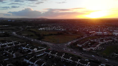 aerial - a residential of lucan, a magic hour cold day with a sunset view from above of the houses and traffics