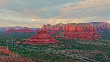 stunning desert alpenglow on sandstone towers of sedona arizona, aerial panoramic