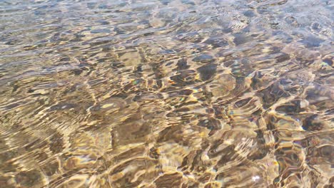 view-of-sea-waves,-rock-and-sand.-sea-shore-water-background