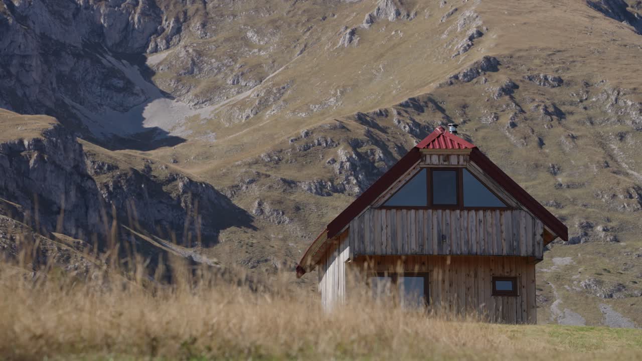 Cozy cabin in Durmitor National Park under mountain, peaceful scene