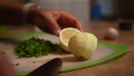Slicing-a-peeled-lemon-in-half---isolated-slow-motion-side-view