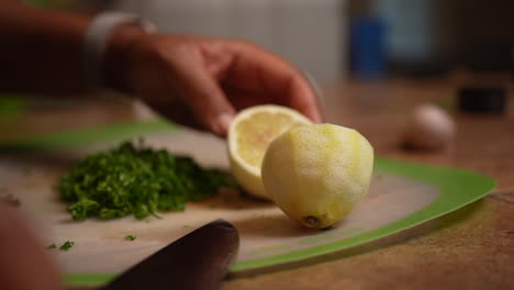 slicing a peeled lemon in half - isolated slow motion side view