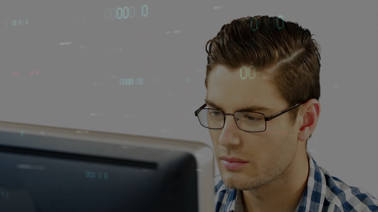 Man sitting behind monitor, watching data feed and interacting with numeric HUD for tech review