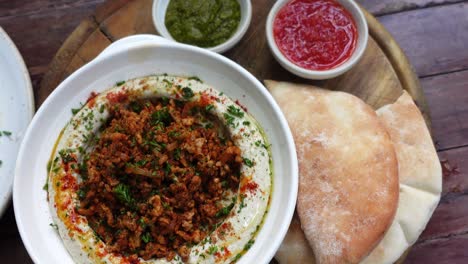 mediterranean paprika meat and hummus with pita bread middle east cuisine top view