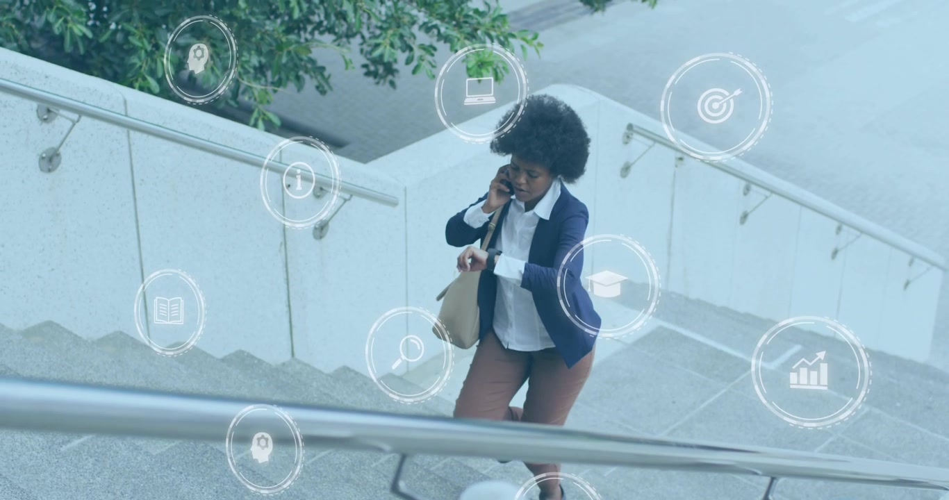 Animation of computer icons over african asian woman talking on cellphone and moving up steps