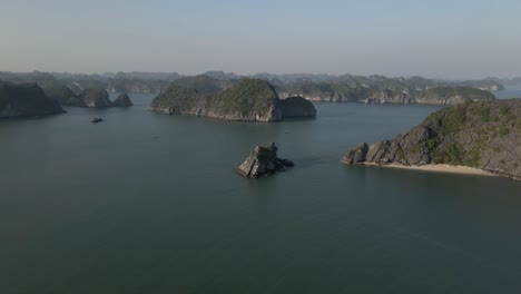 aerial: steep rock islands dot famous tourist destination, ha long bay