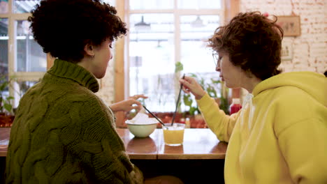 lesbian couple in a bar