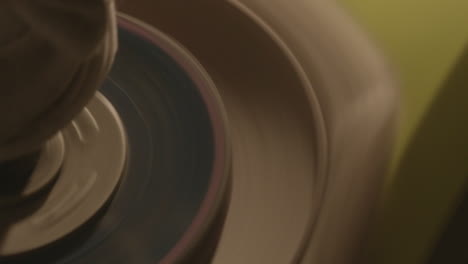 close-up of polishing machine buffing on a yellow car