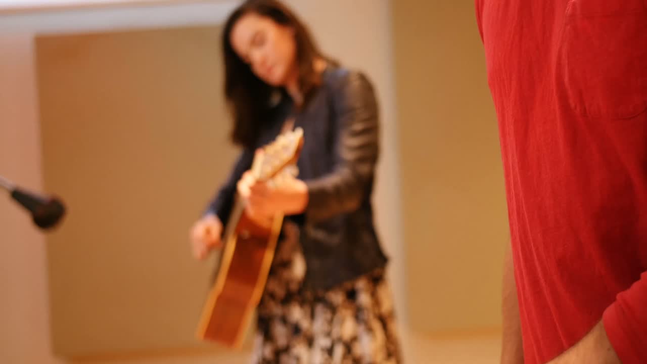 Music band performing in a studio