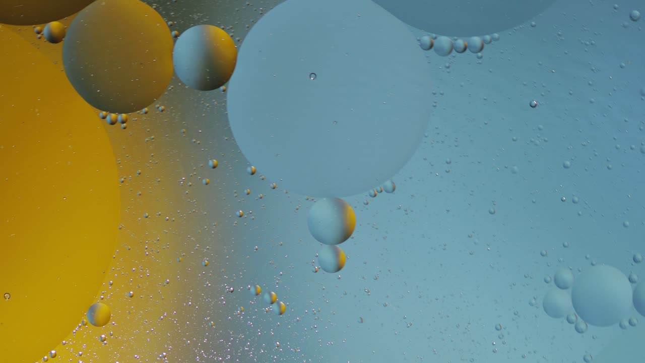 Macro structure of colorful oil bubbles. Chaotic motion. Abstract multicolored background. Pattern