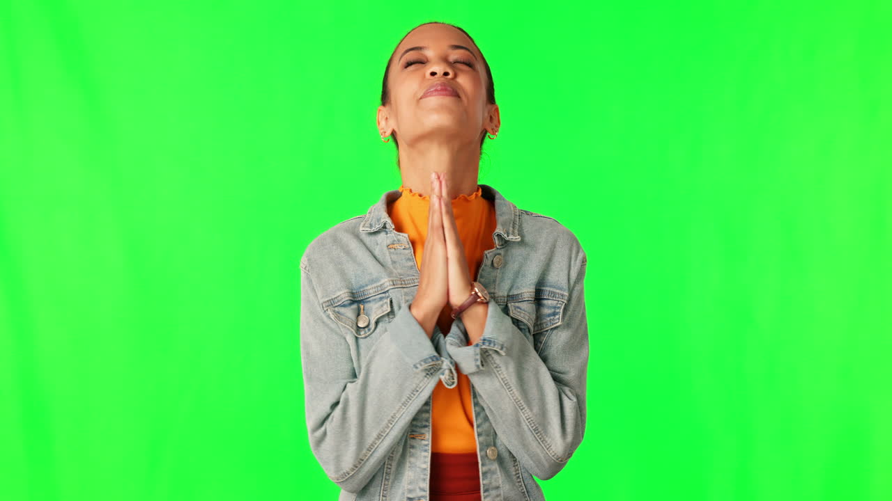 Praying, wish and a woman on a green screen