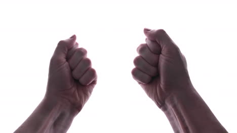 close up of man's hands clench into fists, isolated in white background - studio shot