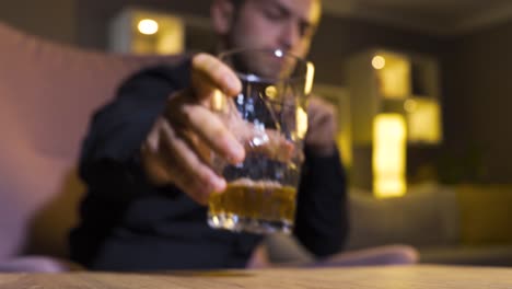 stressed man drinking alcohol, whiskey.