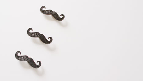 Video-of-three-black-false-moustaches-on-white-background