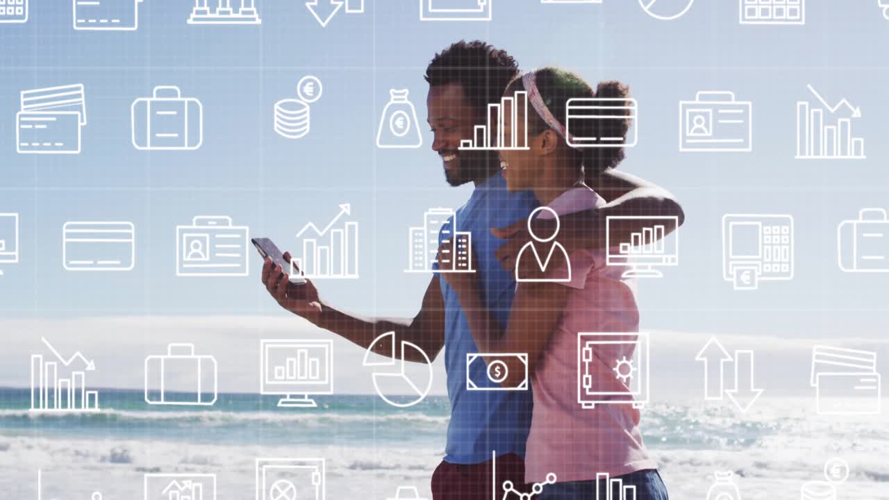 Walking on beach, couple with animation of financial data icons in view