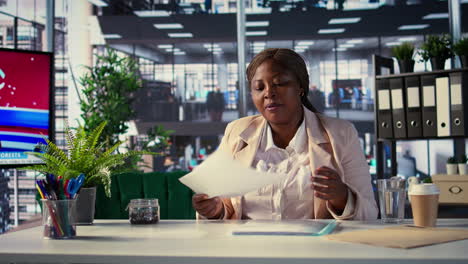 business woman reviewing documents in office