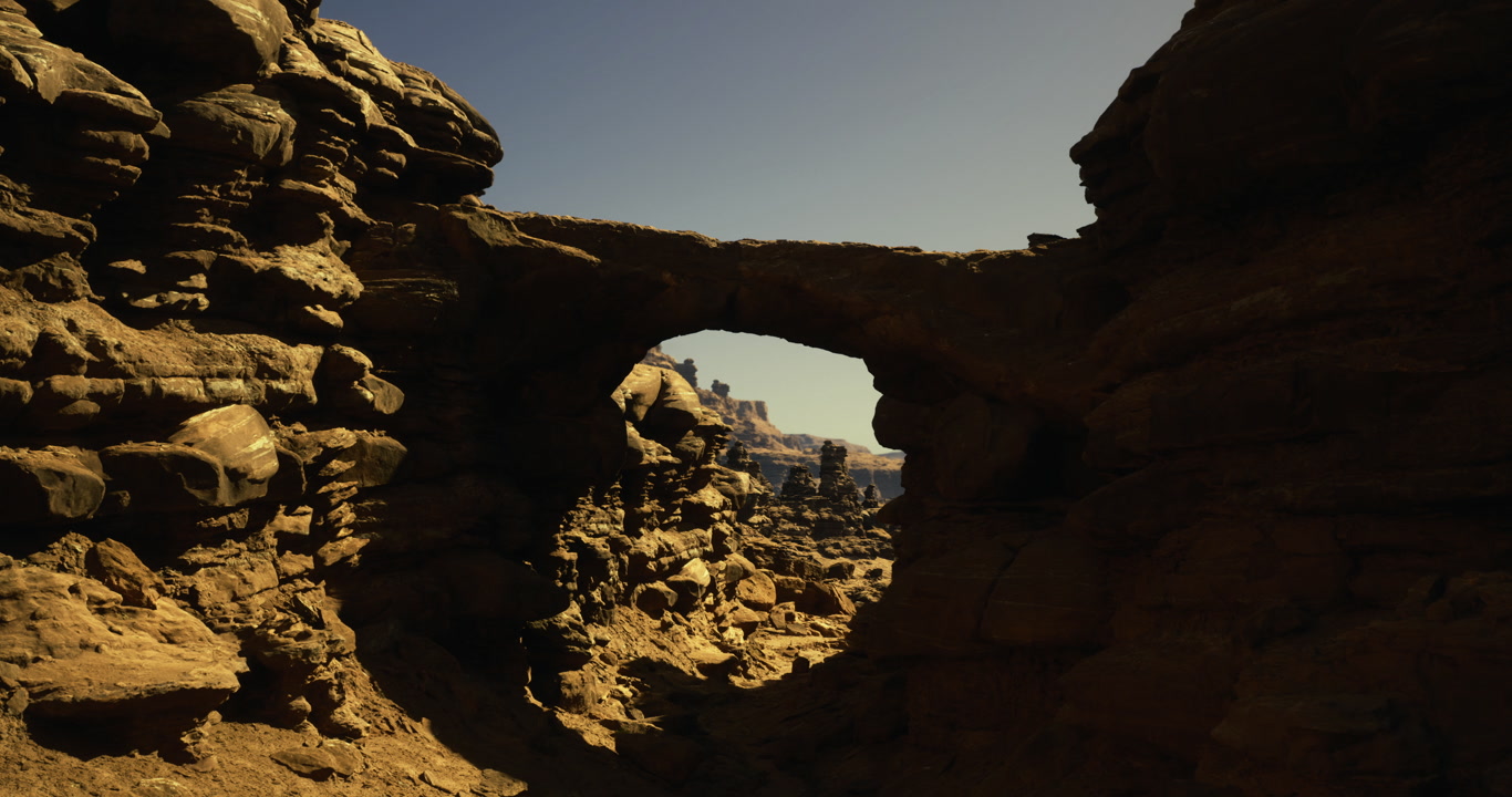 Unique rock formation with natural arch in a desert landscape during daylight