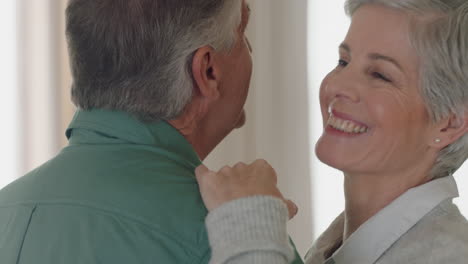 happy mature couple dancing at home enjoying romantic dance together celebrating relationship milestone having peaceful retirement 4k