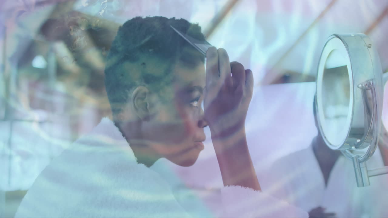 Animation of water ripples over happy african american woman combing hair in mirror