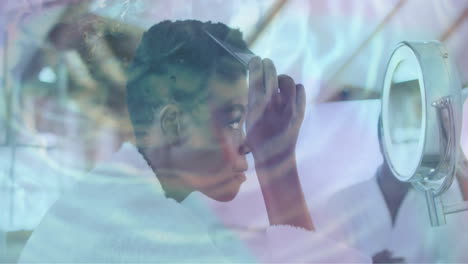 Animation-of-water-ripples-over-happy-african-american-woman-combing-hair-in-mirror