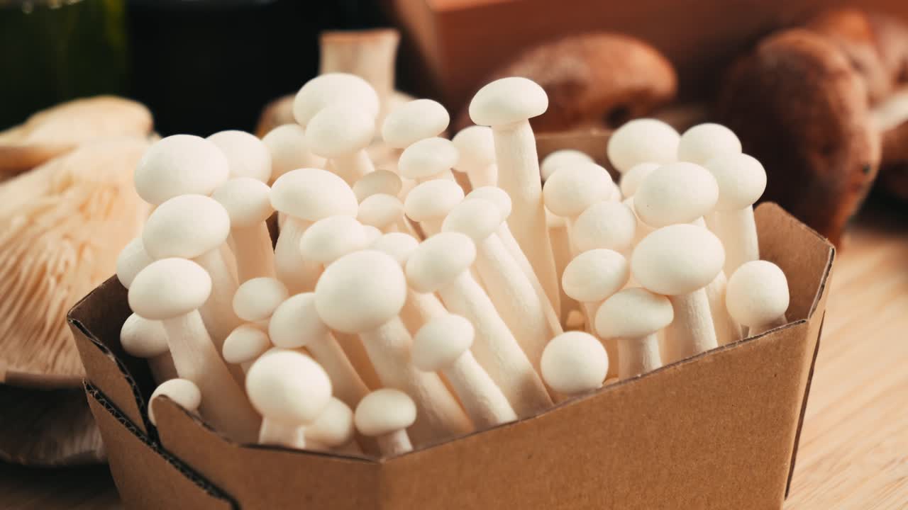 Fresh White Button Mushrooms in a Cardboard Box