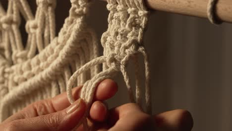 Close-up of Hands Macrame Knotting