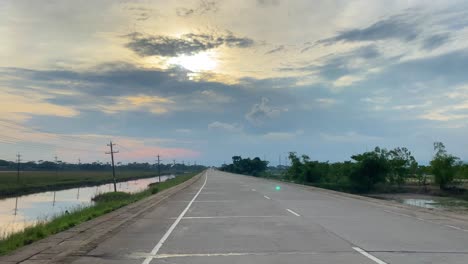 point of view from vehicle traveling along country road bangladesh