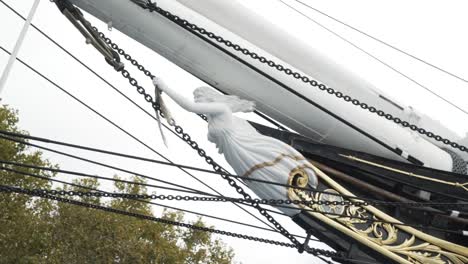 details of a ship's rigging and figurehead