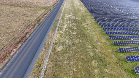 rows of solar panels beside a rural road, australia
