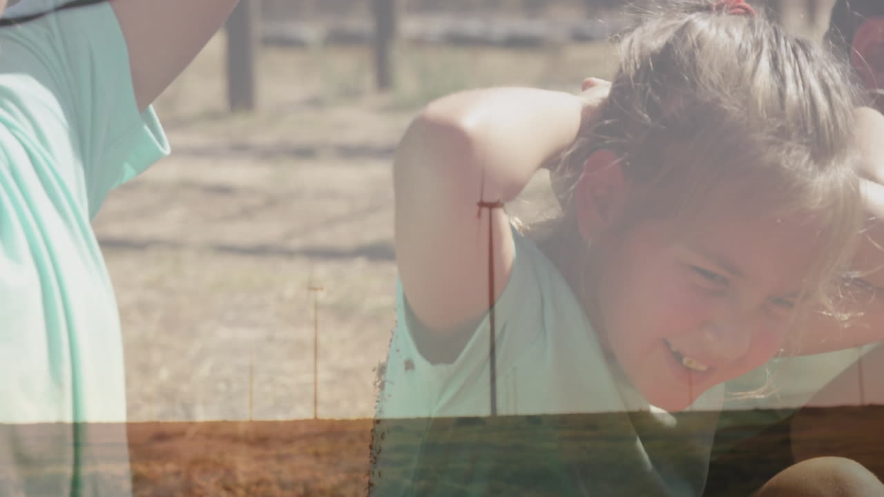 Exercising outdoors, child with wind turbines in background, enjoying fresh air