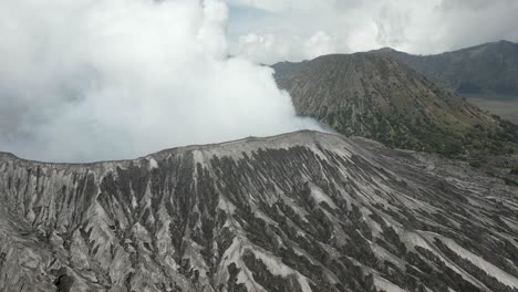 aerial view: eroded ash slope on rim of mt bromo volcano in java, idn