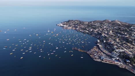 flyover waterfront pier, marina in small fishing village, tongoy chile