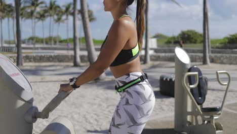 sporty woman working out on machines