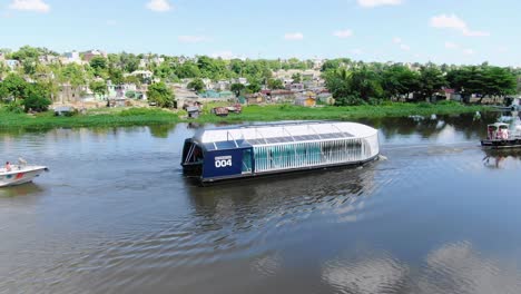 scenic shot on the ozama river overlooking the 004 interceptor, moving through the water