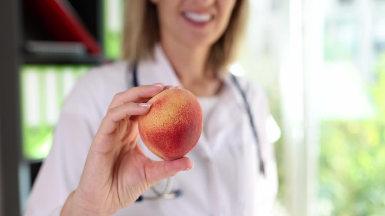 Doctor Holding a Fresh Peach