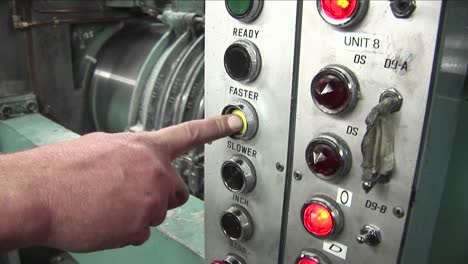 a man presses a machine to make it go faster