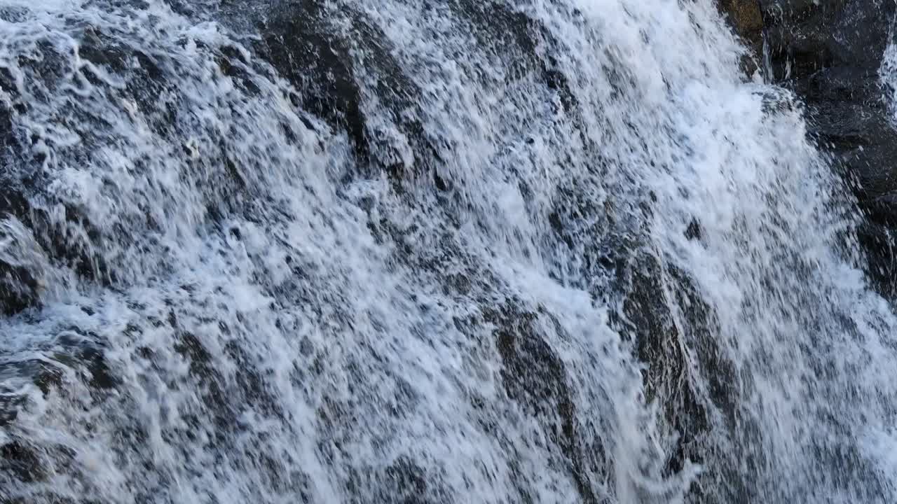 Close-up view of a powerful, cascading waterfall