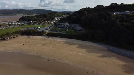 Aerial-view-Red-wharf-bay-coastal-tavern-restaurant-on-the-isle-of-Anglesey,-North-Wales,-pull-away-shot