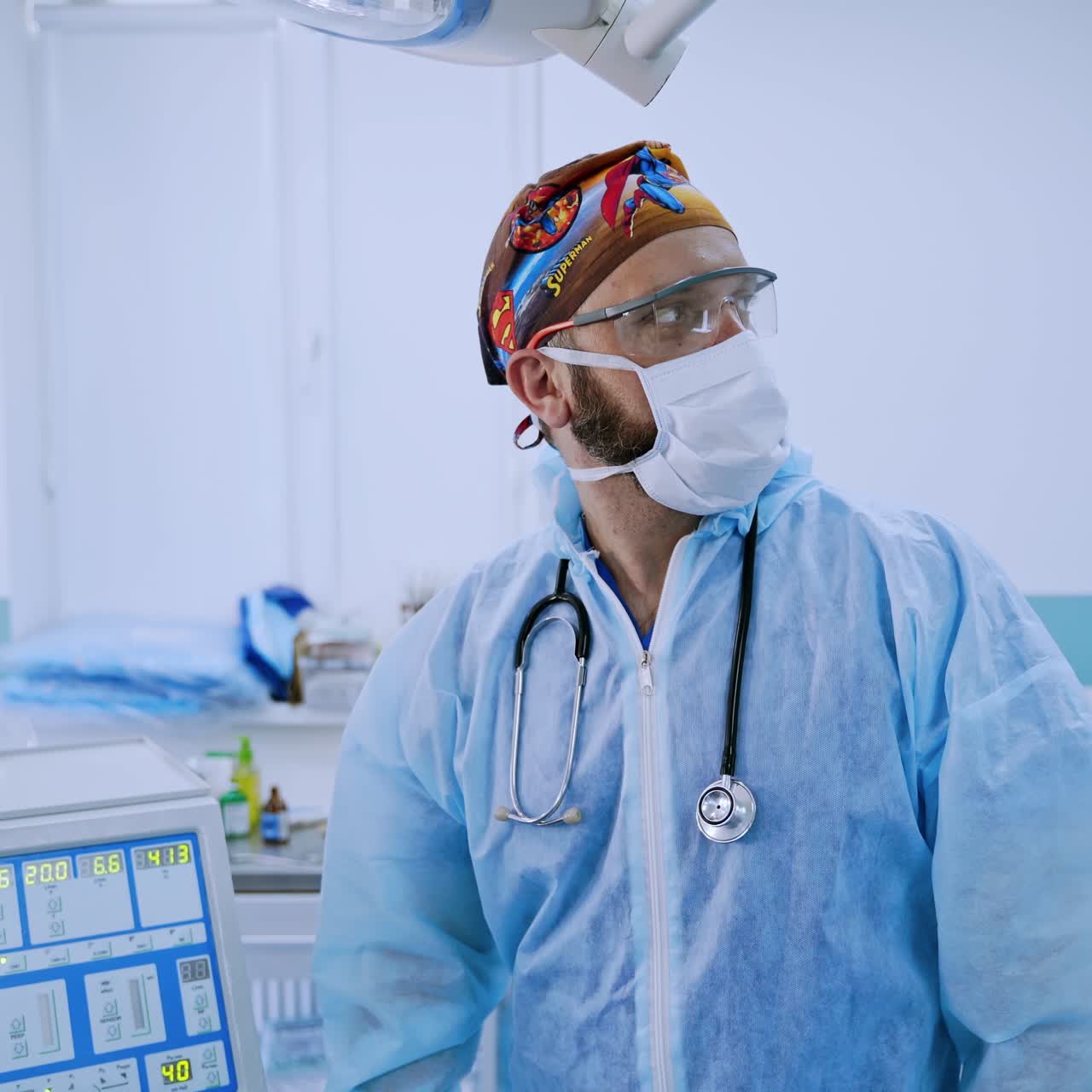 Surgical team preparing their patient for surgery. Team surgeon at work in operating room.
